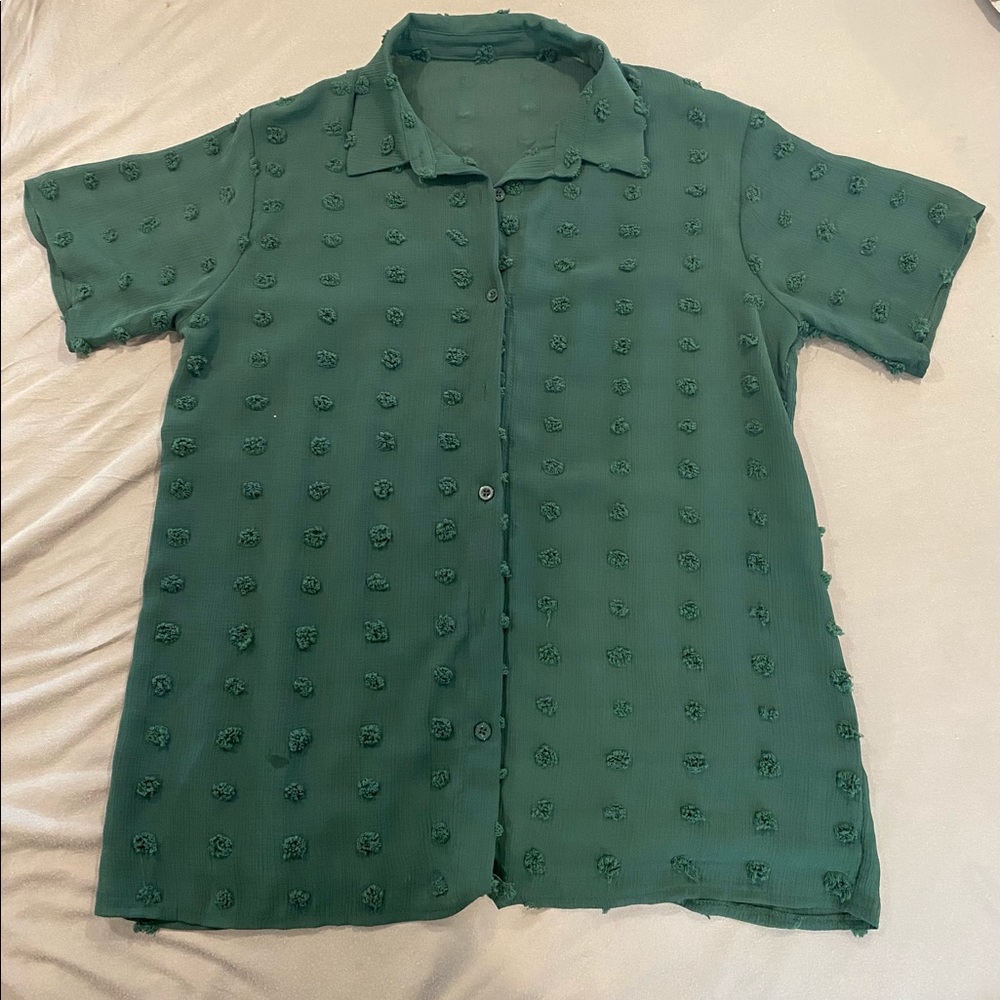 Forest green blouse, slightly transparent.